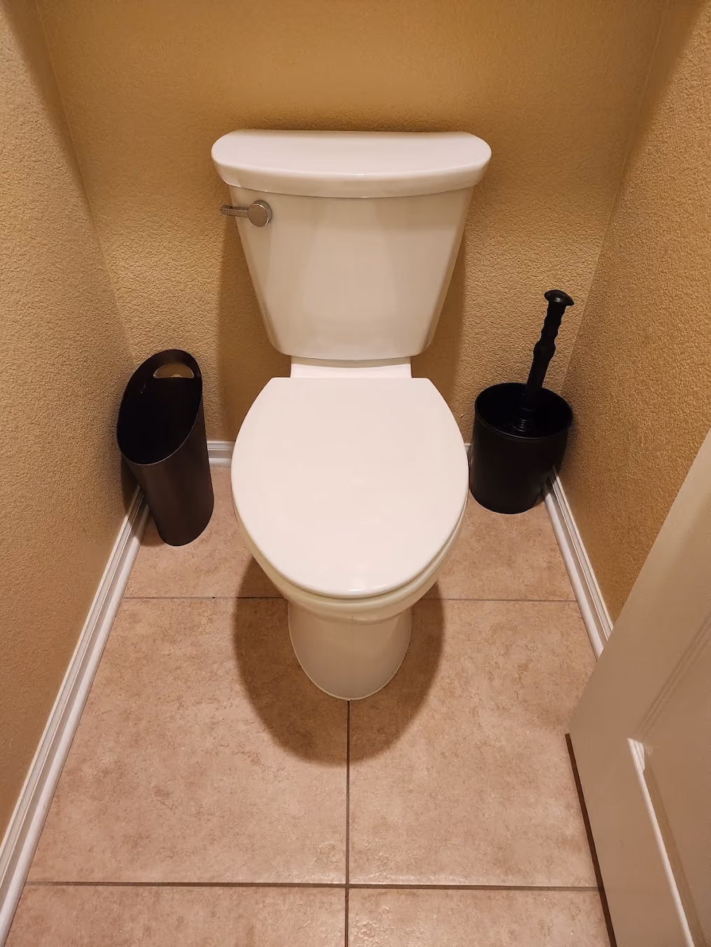 A toilet in a half bath