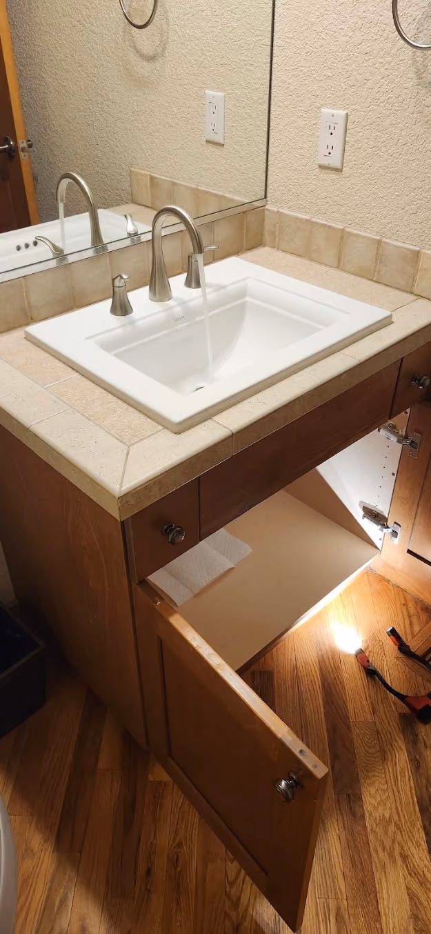 A drop-in bathroom sink with a new faucet