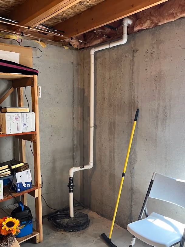 New water lines run along a basement wall