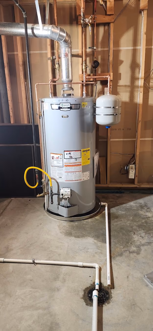 A new gas water heater with an expansion tank on the cold line