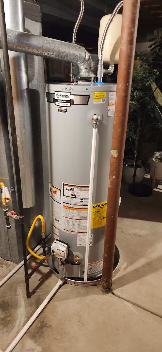 A new water heater with its gas valve and flexible gas line