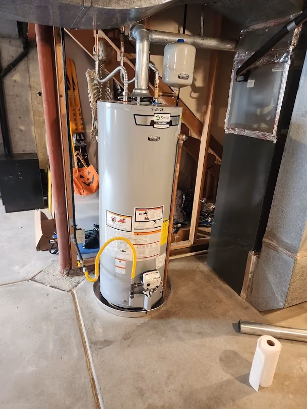 A new gas water heater in an unfinished basement
