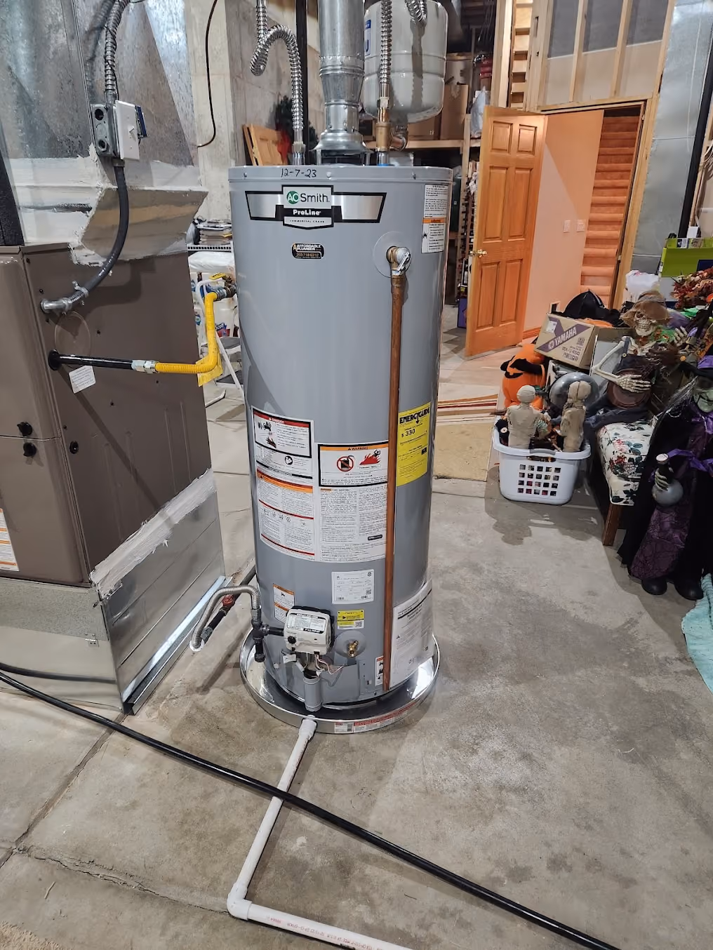 A new gas water heater in a garage