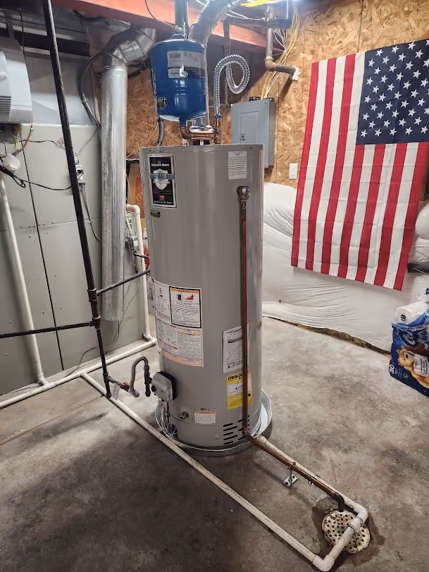 A gas water heater on a stand in a garage