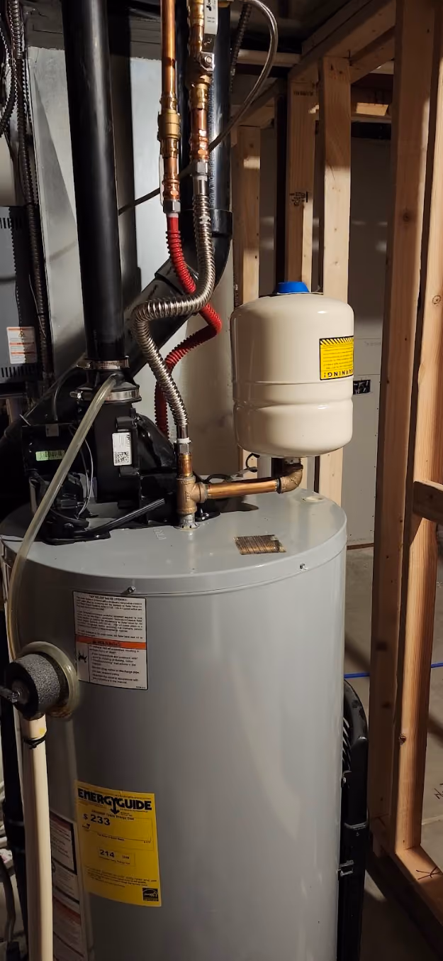 The top of a water heater with a new expansion tank